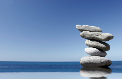 photo of a stack of large stones on the beach